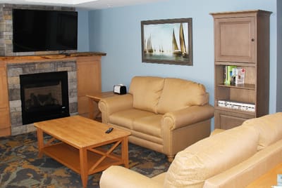 Common area with seating and fireplace
