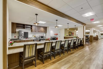 Interior view of a dining area with counter and chairs