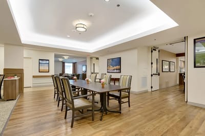 Interior view of a common area with dining table and chairs