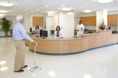 Reception area with staff and a resident