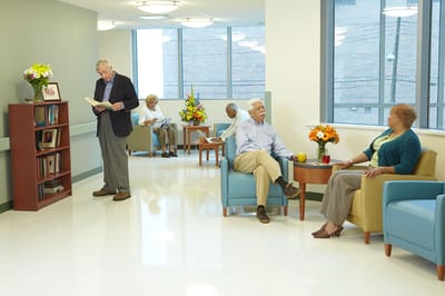 Residents socializing in a bright common area