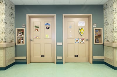 Decorated doors of resident rooms in a hallway
