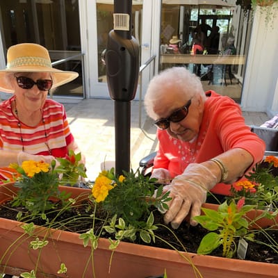 Residents gardening together outdoors