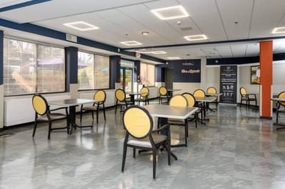 Bright dining area with tables and chairs