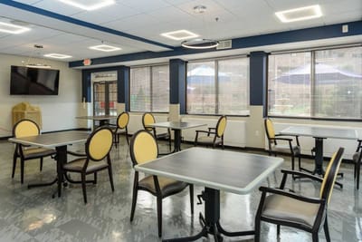 Interior view of a common area with tables and chairs
