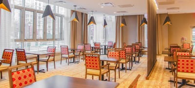 Bright dining room with red and wood furniture