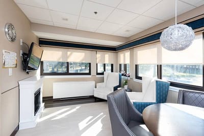 Bright common area with seating and windows