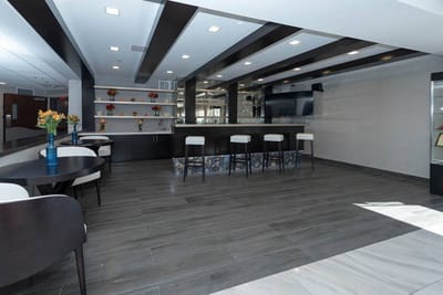 Bright interior common area with seating and bar