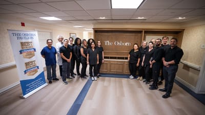 Staff members posing in the facility's lobby area