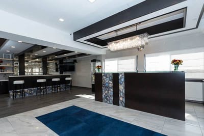 Modern common area with seating and a bar