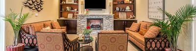Common area with comfortable seating and a fireplace
