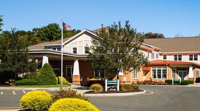Exterior view of Peregrine Delmar Place with landscaped entrance