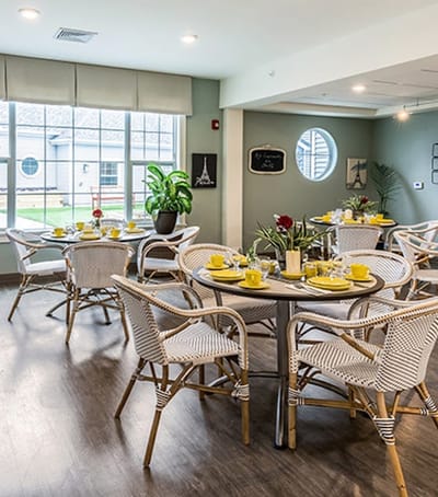 Bright dining area with tables set for a meal