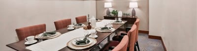 A well-set dining table in a cozy dining room