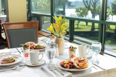 Dining table set with a delicious breakfast spread