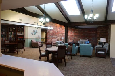 Interior common area with seating and bookshelves