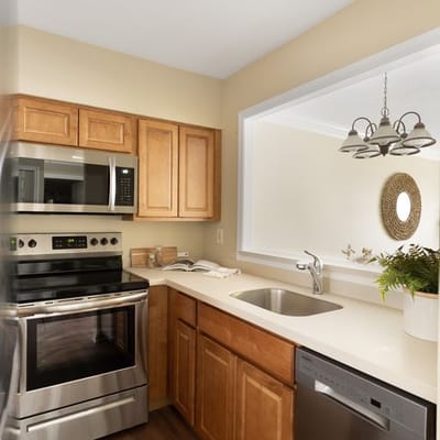 Modern kitchen interior with wooden cabinets and appliances