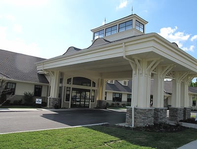 Exterior view of the facility entrance with a covered area