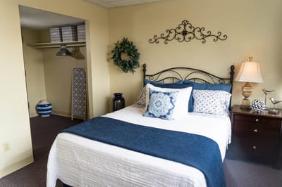 A well-furnished resident room with a cozy layout