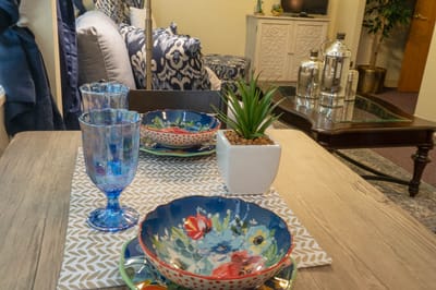 Decorative dining table setting in a cozy common area