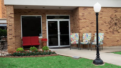 Exterior view of Ash Street Place entrance with seating