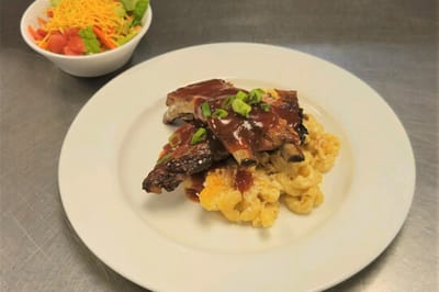 Plated meal with barbecue ribs and macaroni