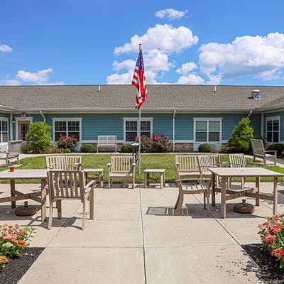 Outdoor patio area with seating and American flag