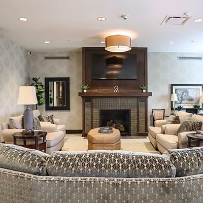 Cozy common area with comfortable seating and a fireplace