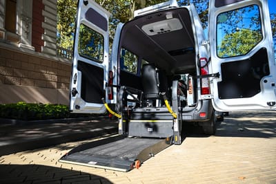 Interior of a facility transport vehicle with a wheelchair lift