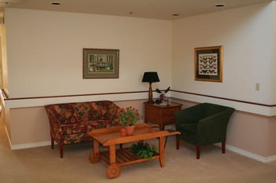 Cozy seating area with floral couch and decorations