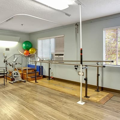 Interior view of a rehabilitation space with exercise equipment