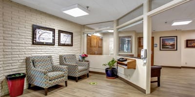 Interior of a waiting area with seating and decor