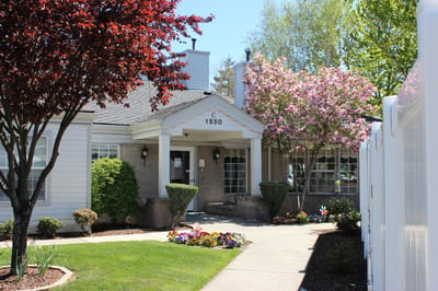 Exterior view of Farmington Square Medford with blooming trees
