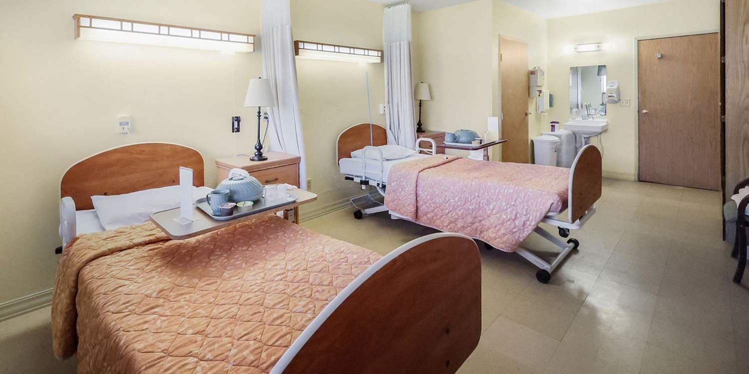 Private resident room with two beds and shared bathroom