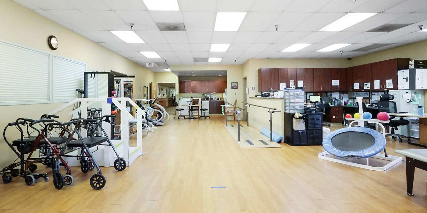 Interior view of a rehabilitation space with therapy equipment