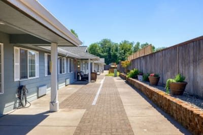Outdoor pathway with seating and garden planters