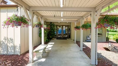 Covered entrance with hanging flower pots