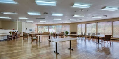 Bright common area with tables and chairs
