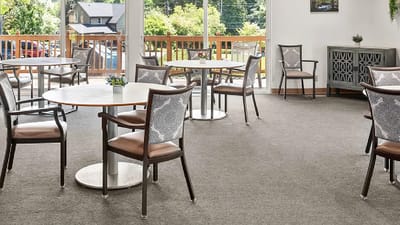 Bright common area with tables and chairs