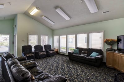 Comfortable common area with seating and large windows