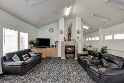 Cozy common area with comfortable seating and a fireplace
