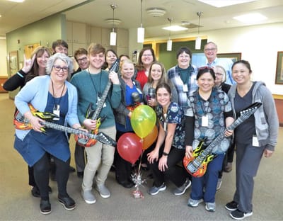 Staff and residents celebrating with activities indoors