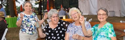 Residents enjoying an outdoor celebration with drinks