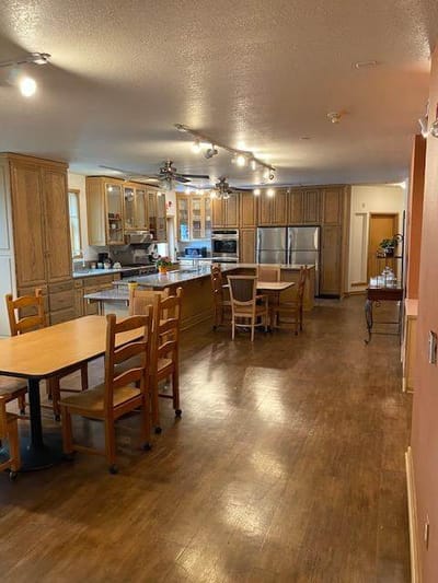 Bright kitchen area with tables and chairs