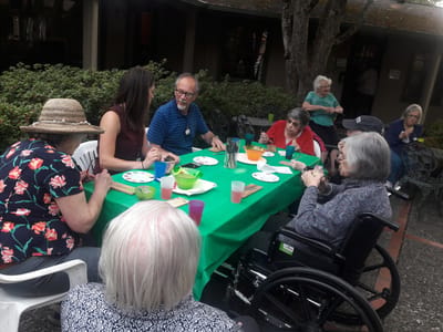 Residents and staff enjoying an outdoor activity together