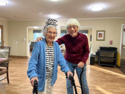 Two residents celebrating New Year's in a common area
