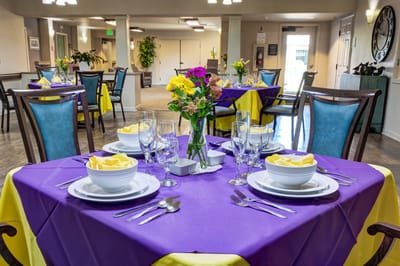 Dining setup with flower centerpiece in a communal area