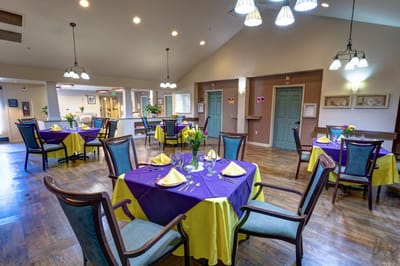 Bright dining room with tables set for a meal