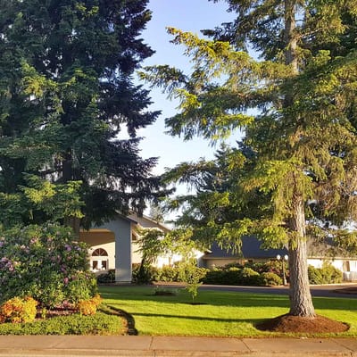 Exterior view of Magnolia Gardens with landscaped grounds