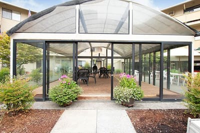 Garden room with seating and plants